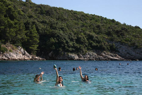 Members of the Balkan Youth Climate Movement play in the sea around the Croatian island of Šolta (Pic: Balkan Climate Youth Movement)