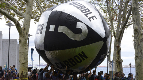 Crowds flood Wall Street carrying a "carbon bubble" in demo for climate action (Pic: Flickr/Stephen Melkisethian)
