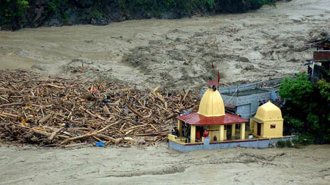 Flood waters crash against a Hindu temple in Uttarkhand, India (Pic: AFP Photo/Indian Army)