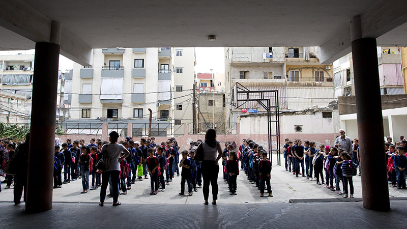 Syrian refugee students line up for classes at Bourjhammoud Public School #2 in Beirut, Lebanon on June 2, 2014. Photo © Dominic Chavez/World Bank