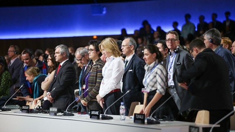 Negotiators held a minute's silence on Sunday for victims of Paris terror attacks (Photo from IISD/ENB)