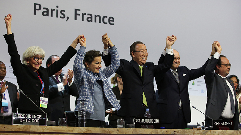 Laurence Tubiana, COP 21/CMP 11 Presidency; UNFCCC Executive Secretary Christiana Figueres; UN Secretary-General Ban Ki-moon; COP 21/CMP 11 President Laurent Fabius, Foreign Minister, France; and President François Hollande, France, celebrate the adoption of the Paris Agreement (credit: IISD.ca/Kiara Worth)