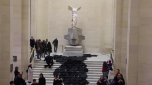 Anti-fossil fuel activists stage Louvre oil slick