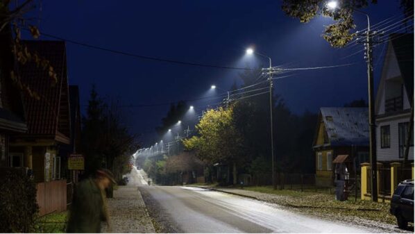 A residential street lit by LED lamps at night
