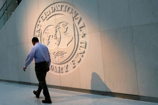 A man walking past the IMF headquarters