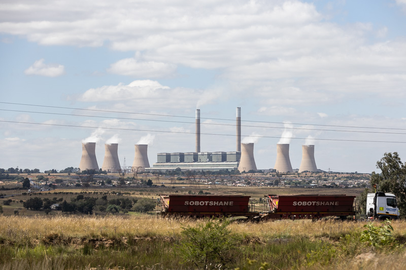 Duvha power station, located in Mpumalanga, South Africa, operating in the background.