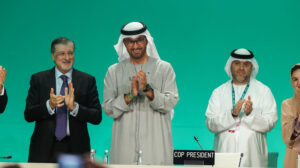 Cop28 president Sultan Al Jaber applauds in the closing plenary
