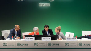 officials in discussion at Cop28 climate talks in Dubai