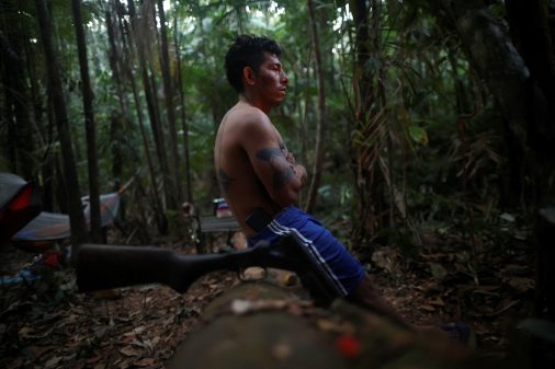 Robson Paes sits in the Amazon rainforest during an expedition of Munduruku people as they mark the frontier of the Sawre Muybu Indigenous Territory, in Itaituba municipality, Para state, Brazil, July 20, 2024. COP30 Amazon host strikes "largest carbon credit sale in history"