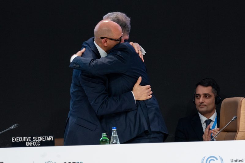 UN climate chief Simon Stiell hugging COP29 president Mukhtar Babayev in the closing plenary of negotiations in Baku, Azerbaijan. 